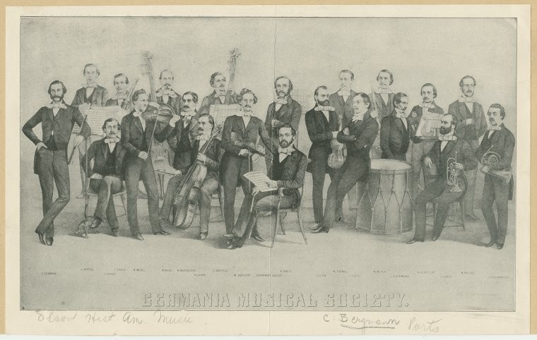 Group portrait of the Germania Musical Society C. Bergmann, Leader seated in front holding piece of music. Image ID: 2011371