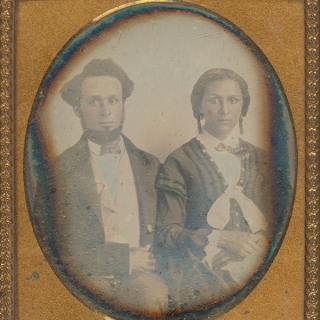 Archival photo of a male and female person.