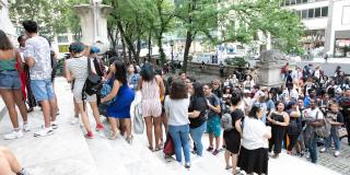 Photo from NYPL's Anti-Prom featuring teens waiting outside 42nd Street library