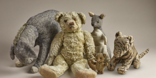 Original stuffed animals Winnie the Pooh, Eeyore, Kanga, Piglet, and Tigger.