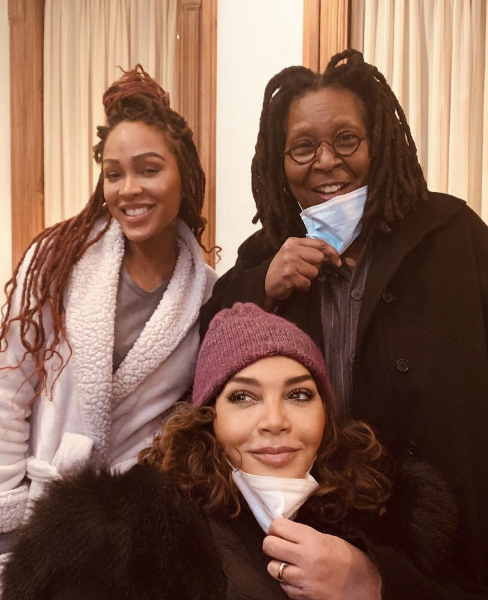 Meagan Good, Neema Barnette, and Whoopi Goldberg. Barnette and Goldberg have their face masks pulled to their chin. Good is not wearing a mask.