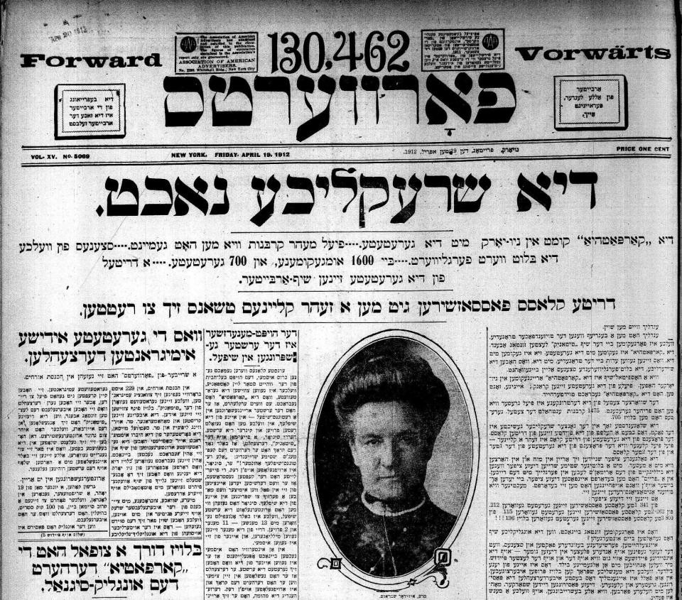 Top half of front page of Forverts newspaper for 19 April 1912; below the title of the newspaper, a headline across the page; below the headline, at center, between articles to either side, a woman's face stares out of a large oval