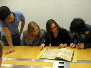 The class is in awe of the Bach manuscript