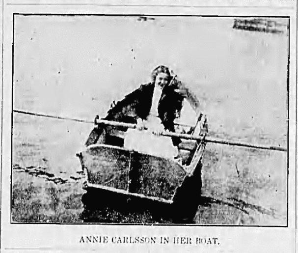 Annie Carlsson in her boat, rowing between Staten Island and Bergen Point Light