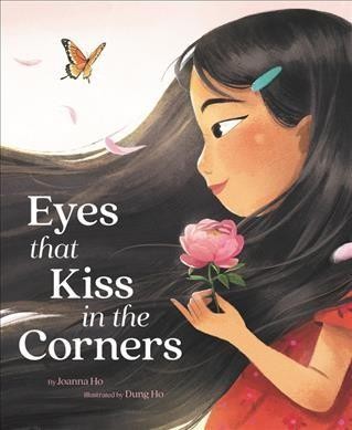 Book cover image with the title Eyes that Kiss in the Corners showing the side profile of an Asian girl with long black hair holding a flower