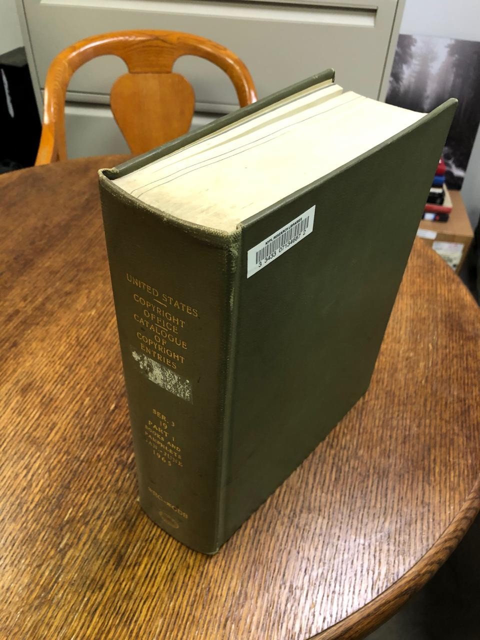 A large volume of the Catalog of Copyright Entries, several inches thick