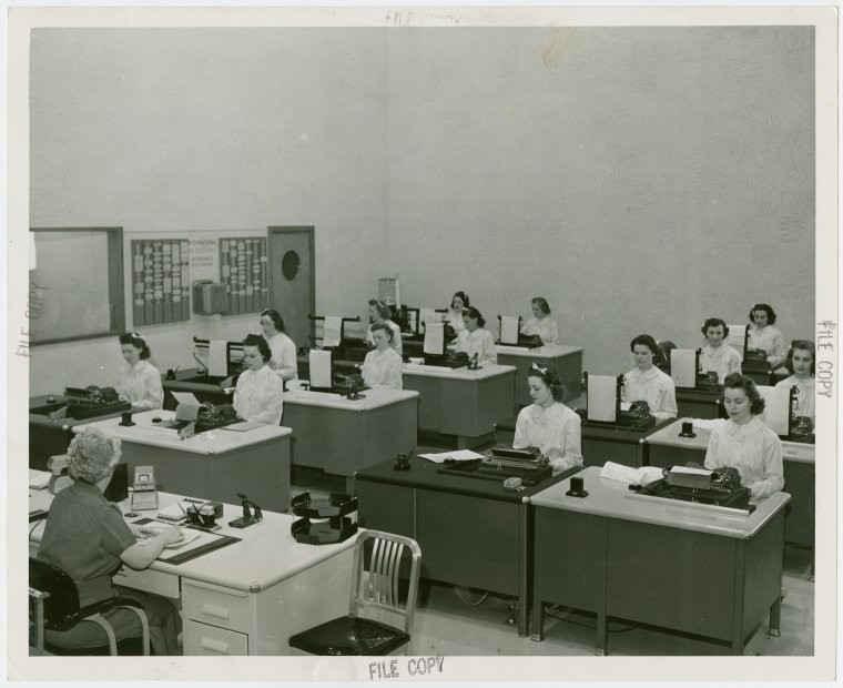 Black-and-white photo of stenographers in office, 1939-1940