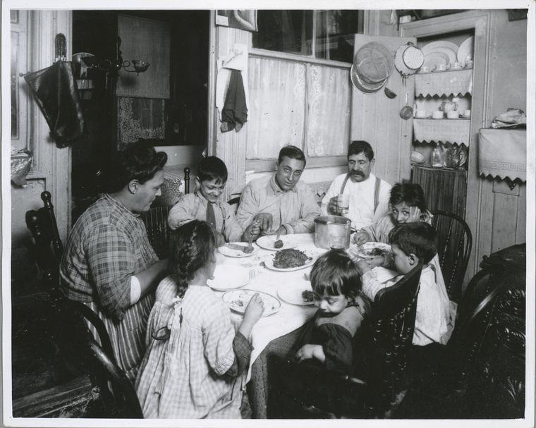 Historic image of a family in a tenement in New York. 