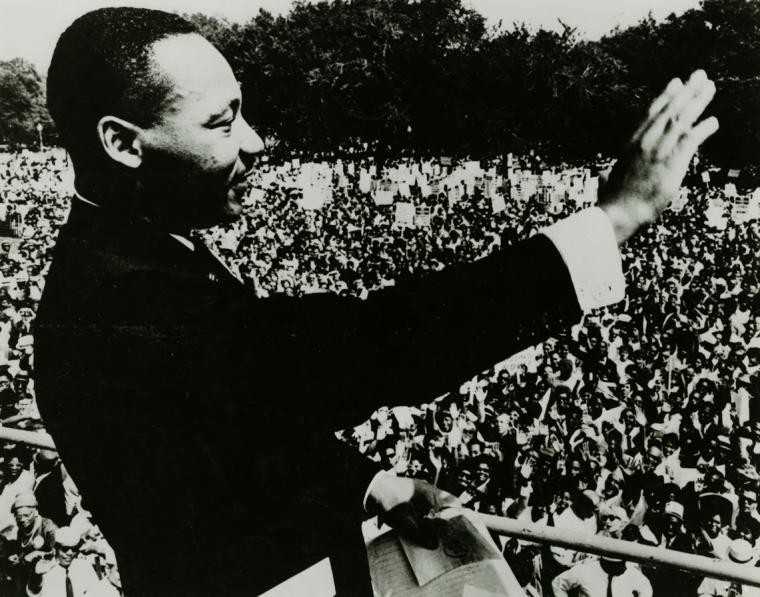 Martin Luther King Jr. standing in front of a crowd of people