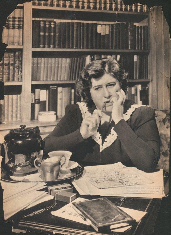 Gertrude Berg sitting at desk