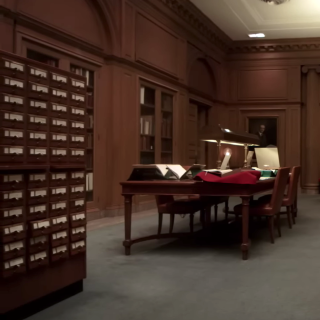 Interior of the Berg Collection featuring a study table and card catalog cabinet.