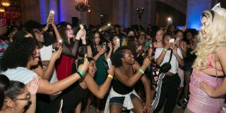 Photo from NYPL's Anti-Prom featuring teens taking photos with cellphones