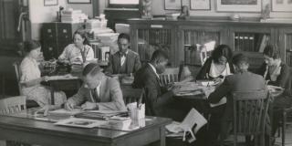 Researchers using the Schomburg Collection, when it was the 135th Street Branch Library Division of Negro Literature, History and Prints