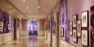 photograph of exhibition, looking down the corridor gallery