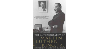 Book cover of The Autobiography of Martin Luther King, Jr. by Martin Luther King, Jr. and Clayborne Carson featuring a historic photo of Martin Luther King, Jr. looking off into the distance next to a photo of Gandhi
