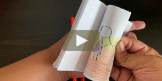 A pair of hands holds a small flipbook.