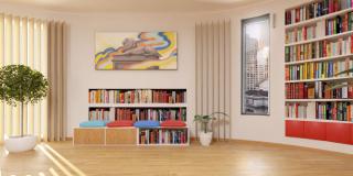 Rendering of a virtual library space featuring bookshelves and a library lion painting.