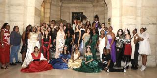 Anti-Prom attendees posing under an archway in the Stephen A. Schwarzman Building.