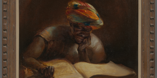 A framed painting of a dark-skinned individual wearing a colored turban on their head and reading a large tome