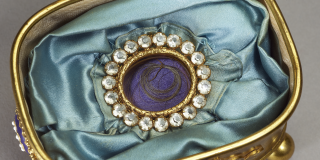 Lock of Ludwig van Beethoven’s hair; nestled in an ornate box on top of light blue satin