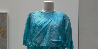 Costume worn by Loie Fuller; garment of blue silk, darker at the bodice and gradually lightening toward the uneven edges of the floor-length skirt