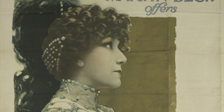 A poster featuring a colorized photograph of Sarah Bernhardt in tones of peach, green, and gold. She is shown in profile, wearing an elaborate costume, above her name and a list of the company’s repertoire