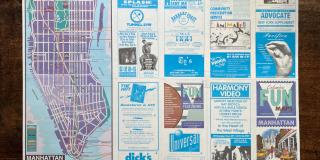 A fold-out printed map of Manhattan with many advertisements for LGBTQ+ businesses.