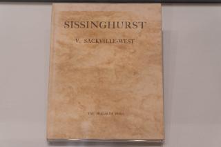 A textured, beige book cover titled Sissinghurst by V. Sackville-West, with The Hogarth Press in small type at the bottom