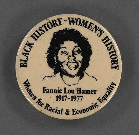 Off-white button pin featuring a portrait of Fannie Lou Hamer with her name and life dates, as well as the words “Black History ~ Women’s History” and “Women for Racial & Economic Equality”