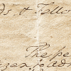 Closeup photo of a historical document with cursive script
